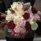Multicolored bouquet in a hat box